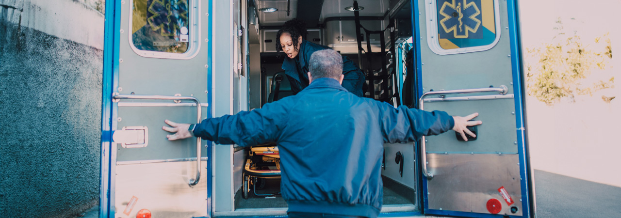 ems worker opening ambulance doors